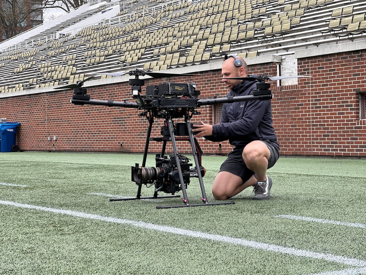 AGL Aerials operator preparing a Freefly Alta X with a Ronin 2 and cinema camera on location